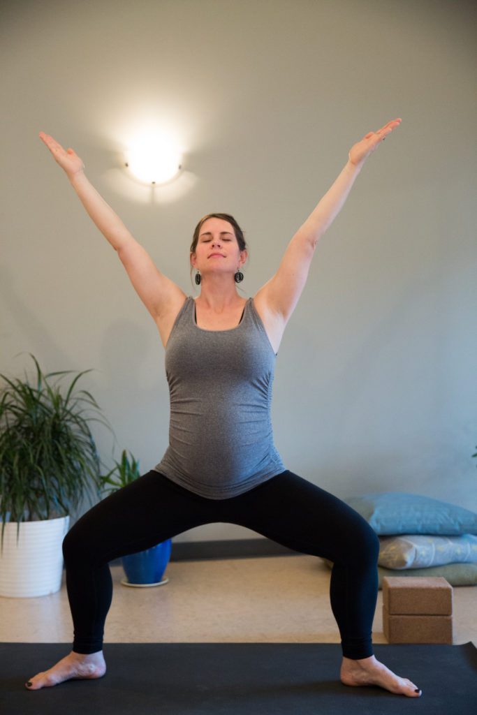 pregnant woman doing the prenatal friendly goddess yoga pose