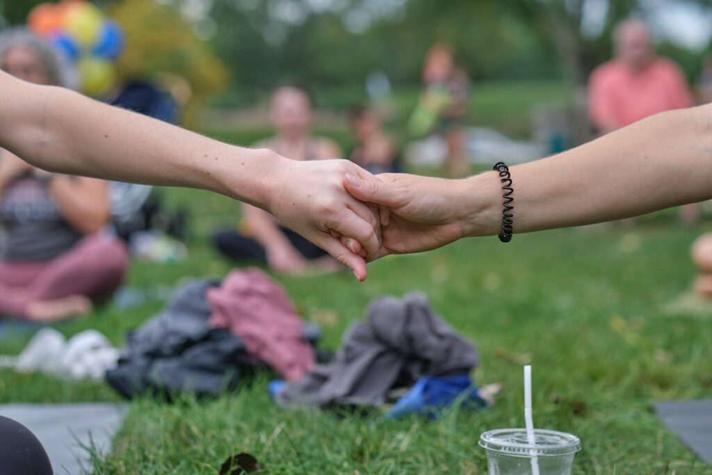 Two people holding hands